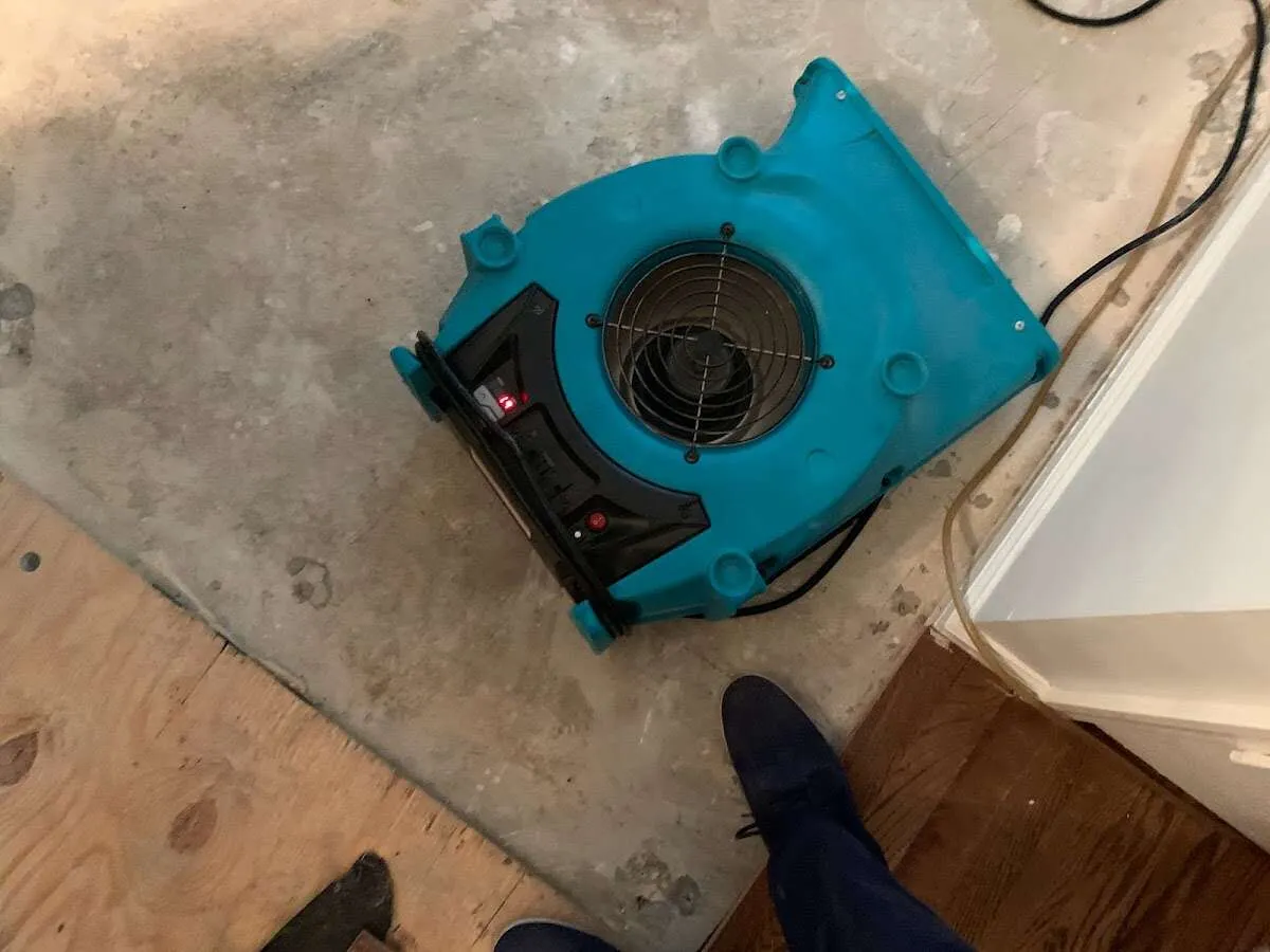 Air mover drying subfloor during Leak Detection & Repair in Gadsden